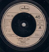 A WOMAN IN LOVE / I LIE AWAKE AND DREAM OF YOU (looks unplayed)